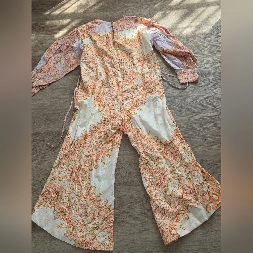 This is a Free People Blooming Fields wide-legged jumpsuit with a paisley bohemi - Picture 4 of 10